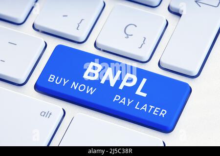 BNPL or buy now pay later message on blue computer Keyboard Key Stock Photo