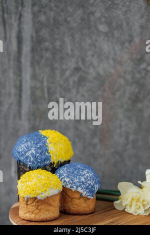 Delicious Easter cake and ingredients on wooden table. Stock Photo