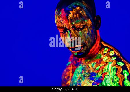 afro american man posing in studio shot with UV light Stock Photo