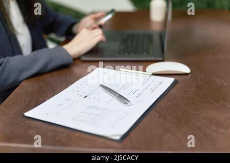 folder with documents on the desk of a business woman. close-up. Stock Photo