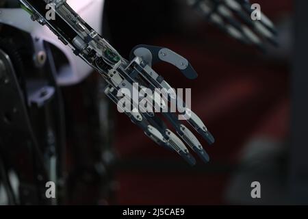 Dark metal robot arm. Technology and science concept Stock Photo