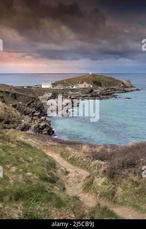 The coast path leading to the rugged Towan Head on the coast of Newquay in Cornwall in the UK. Stock Photo