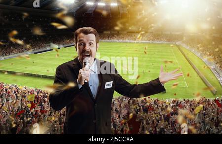 Proud man, professional sport commentator having online TV stream,  broadcasting football match isolated over stadium background Stock Photo -  Alamy