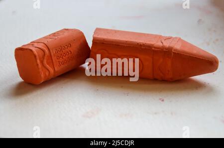 Broken stick of chalk to make drawings on the street in brown color Stock Photo