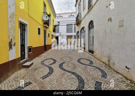 Rua da Estrema Street-yellow and white townhouses-intertwined lines paving. Lagos-Portugal-219 Stock Photo