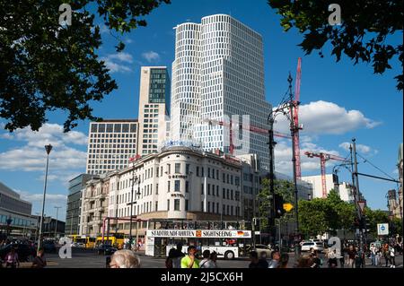 08.06.2019, Berlin, Germany, Europe - Street scene with people and traffic at the corner of the shopping street Kurfuerstendamm and Joachimsthaler Strasse in the district Charlottenburg and the modern high-rise buildings Berlin-Upper West (Atlas Tower) with the hotel Motel One and Zoofenster with the Waldorf Astoria Hotel in the background. [automated translation] Stock Photo