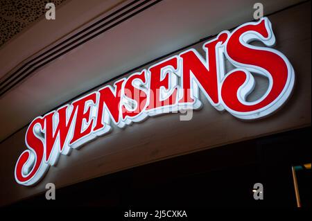 12.03.2020, Singapore, , Singapore - Illuminated company sign with logo ...