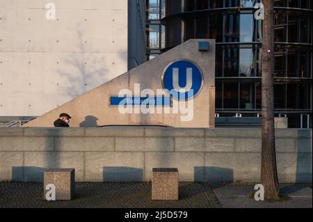Dec. 22, 2021, Berlin, Germany, Europe - Man wearing Corona mouth guard comes out of the entrance to the Bundestag subway station in the government district in Mitte. [automated translation] Stock Photo
