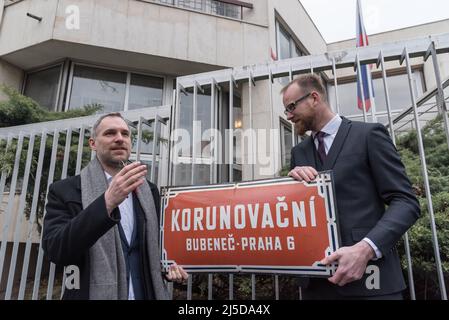 Prague, Czech Republic. 22nd Apr, 2022. Mayor of the Prague Zdenek Hrib (L) and Ondrej Kolar Mayor of Prague 6 remove old street sign in front of the Russian embassy during renaming ceremony. Part of the street where Russian Embassy in Prague is located, was officially renamed to the Ukrainian Heroes street (Ukrajinskych Hrdinu in Czech language). The street was renamed as symbolic act in order to show solidarity and support to Ukraine in ongoing Russian aggression. Credit: SOPA Images Limited/Alamy Live News Stock Photo