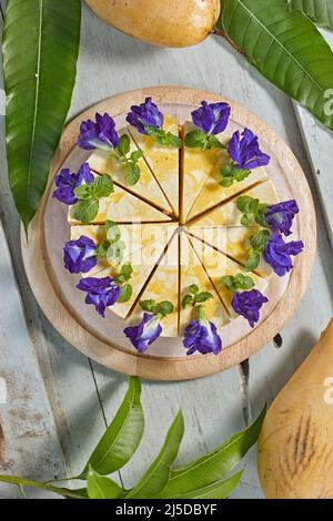mango cheese cake on wood background,selective focus Stock Photo