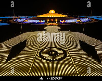 (EDITORS NOTE: Image taken with drone) Aerial view of 250,000 LED lanterns depicting a pattern of a monk meditating as a part of the Earth Day 2022 celebration at Wat Phra Dhammakaya Temple.Wat Phra Dhammakaya Temple celebrates Earth Day by lighting 250,000 LED lanterns in a globe pattern for devotees to meditate and worship together in a worldwide virtual ceremony hosted in Pathum Thani. (Photo by Matt Hunt / SOPA Images/Sipa USA) Stock Photo