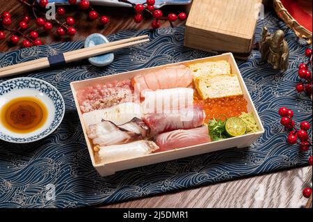 Grilled Fish Belly Seafood Don in a dish with chopsticks isolated on mat side view on wooden table taiwan food Stock Photo