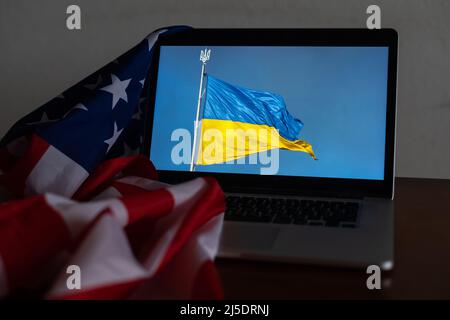 United States Flag and Ukraine Flag on laptop Stock Photo