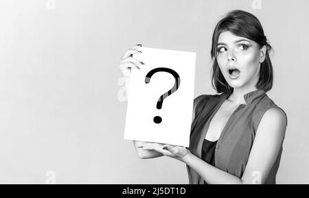 Question mark, symbol. Concept challenging issue, looking for the answer. Woman with doubtful expression and question marks. Thinking woman. Girl Stock Photo