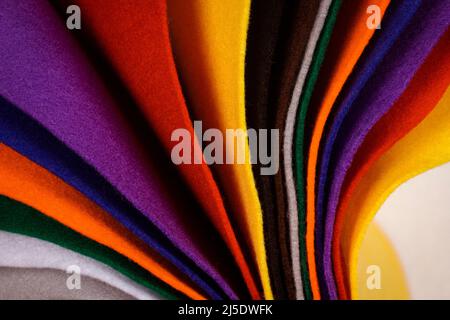 Several colored felt texture background. Assorted color felt fabric sheets, patchwork, sewing DIY craft Stock Photo
