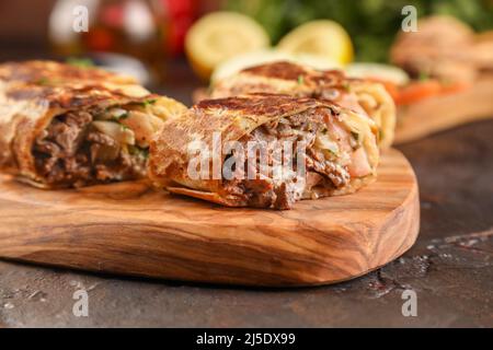 Beef shawarma durum doner kebab copy space. kafta shawarma beef pita wrap roll sandwich traditional arab mid east food Stock Photo