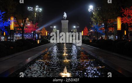 Xian, Shaanxi Province, China: Statues and fountains in Xian, part of the Grand Tang Dynasty Ever-bright City at night. Celebrating the Tang Dynasty. Stock Photo