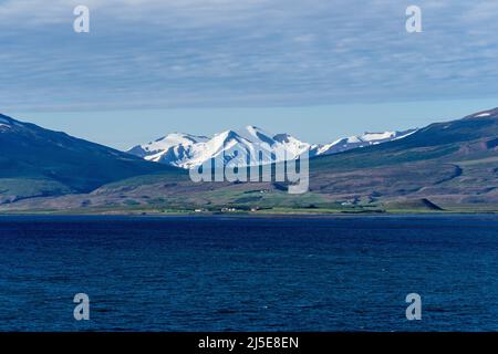 Snow Capped Mountains from Eyjafjörður Fjord, Akureyri, Iceland Stock Photo