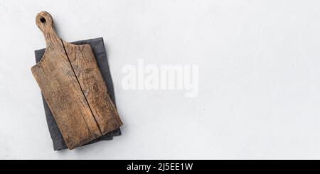 Vintage cutting board on a gray background. Top view, copy space. Stock Photo
