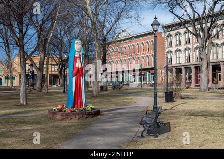 Las Vegas, New Mexico - A sculpture by Margarito Mondragon in the historic central plaza. The sculpture was dedicated to Our Lady of Sorrows Catholic Stock Photo