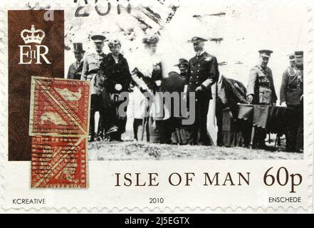 Photo of an Isle of Man postage stamp with an illustration of King George V and Queen Mary during a visit in 1920 Issued in 2010 Stock Photo