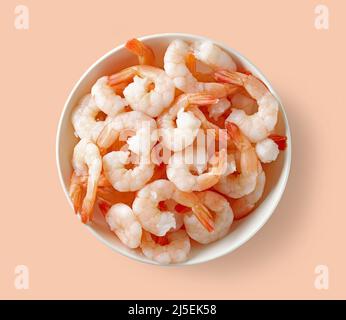 bowl of red prawns isolated on pink background, top view Stock Photo