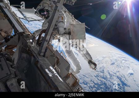 International Space Station, EARTH ORBIT. 23 March, 2022. ESA astronaut and Expedition 66 Flight Engineer Matthias Maurer during a six-hour and 54-minute spacewalk to install thermal gear and electronic components on the International Space Station, March 23, 2022 in Earth Orbit.  Credit: NASA/NASA/Alamy Live News Stock Photo