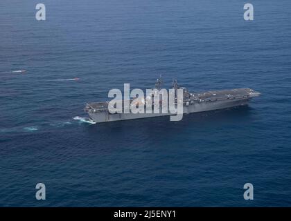 Pacific Ocean, United States. 13 April, 2022. The U.S. Navy Wasp-class amphibious assault ship USS Tripoli during routine operations with the 3rd Fleet, April 13, 2021 in the Pacific Ocean.  Credit: MC2 Malcolm Kelley/Planetpix/Alamy Live News Stock Photo
