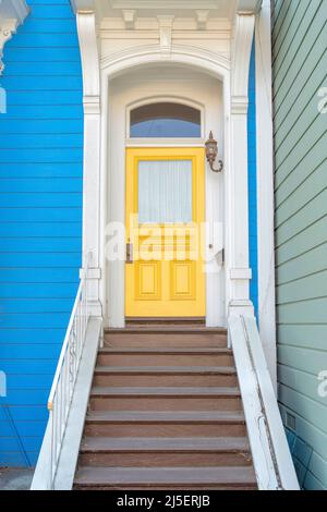 Entrance of a house with ornate columns and wooden doorsteps at San Francisco, California Stock Photo