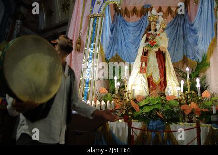 April 22, 2022, Pagani, Campania/Salerno, Italy: Pagani, Salerno, Italy - April 22, 2022 :Musicians seen sing, play tammorra and guitar during feast of Santa Maria Incoronata del Carmine called ''delle Galline''.It is a religious and civil event that takes place annually in Pagani (Salerno) from Friday of the eighth of Easter to the following Monday. The festival, celebrated in the homonymous sanctuary, is organized by the Carmelite Fathers of the sanctuary itself and by the Archconfraternity of the Madonna delle Galline. Tradition tells of a painting depicting the image of the Madonna, found Stock Photo