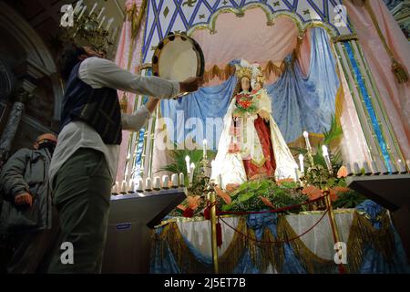 April 22, 2022, Pagani, Campania/Salerno, Italy: Pagani, Salerno, Italy - April 22, 2022 :Musicians seen sing, play tammorra and guitar during feast of Santa Maria Incoronata del Carmine called ''delle Galline''.It is a religious and civil event that takes place annually in Pagani (Salerno) from Friday of the eighth of Easter to the following Monday. The festival, celebrated in the homonymous sanctuary, is organized by the Carmelite Fathers of the sanctuary itself and by the Archconfraternity of the Madonna delle Galline. Tradition tells of a painting depicting the image of the Madonna, found Stock Photo