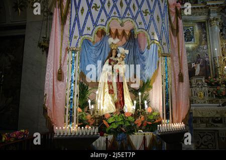 April 22, 2022, Pagani, Campania/Salerno, Italy: Pagani, Salerno, Italy - April 22, 2022 :The statue of Our Lady seen during feast of Santa Maria Incoronata del Carmine called ''delle Galline''.It is a religious and civil event that takes place annually in Pagani (Salerno) from Friday of the eighth of Easter to the following Monday. The festival, celebrated in the homonymous sanctuary, is organized by the Carmelite Fathers of the sanctuary itself and by the Archconfraternity of the Madonna delle Galline. Tradition tells of a painting depicting the image of the Madonna, found by some hens whil Stock Photo