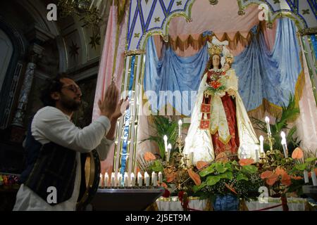 April 22, 2022, Pagani, Campania/Salerno, Italy: Pagani, Salerno, Italy - April 22, 2022 :Musicians seen sing, play tammorra and guitar during feast of Santa Maria Incoronata del Carmine called ''delle Galline''.It is a religious and civil event that takes place annually in Pagani (Salerno) from Friday of the eighth of Easter to the following Monday. The festival, celebrated in the homonymous sanctuary, is organized by the Carmelite Fathers of the sanctuary itself and by the Archconfraternity of the Madonna delle Galline. Tradition tells of a painting depicting the image of the Madonna, found Stock Photo