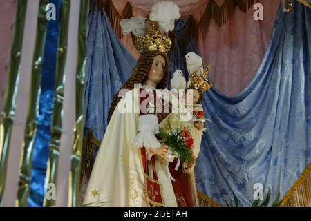 April 22, 2022, Pagani, Campania/Salerno, Italy: Pagani, Salerno, Italy - April 22, 2022 :The statue of Our Lady seen during feast of Santa Maria Incoronata del Carmine called ''delle Galline''.It is a religious and civil event that takes place annually in Pagani (Salerno) from Friday of the eighth of Easter to the following Monday. The festival, celebrated in the homonymous sanctuary, is organized by the Carmelite Fathers of the sanctuary itself and by the Archconfraternity of the Madonna delle Galline. Tradition tells of a painting depicting the image of the Madonna, found by some hens whil Stock Photo