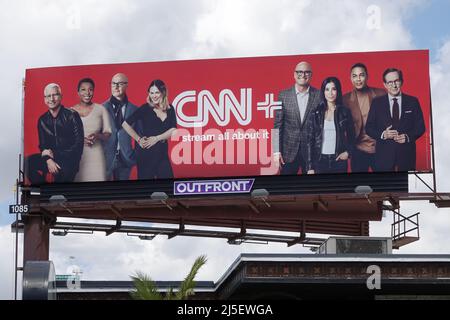 Los Angeles, CA / USA - April 22, 2022: Personalities featured on the CNN+ video streaming service are featured on a billboard atop a building. Stock Photo