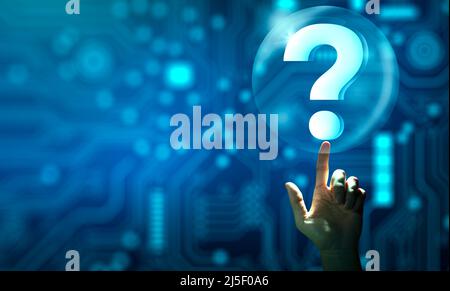 Man hand holding digital question mark holographic. Abstract Technology background. Q and A discussion. FAQ, Support, Question and Answer. Stock Photo