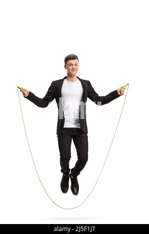 Full length portrait of a young stylish guy skipping a rope isolated on white background Stock Photo