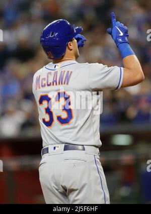 New York Mets' James McCann hits a single during the fifth inning of ...