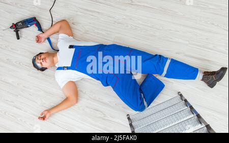 The worker after falling from height - unsafe behavior Stock Photo