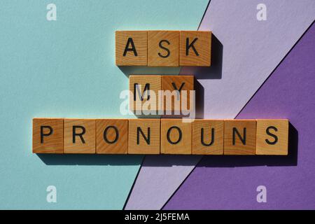 Ask My Pronouns, phrase in wooden alphabet letters isolated on colourful background Stock Photo
