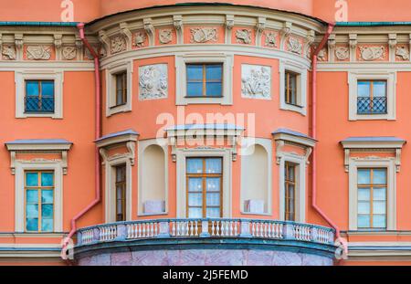 Balcony and many windows in a row on the facade of the urban historic apartment building front view, Saint Petersburg, Russia Stock Photo