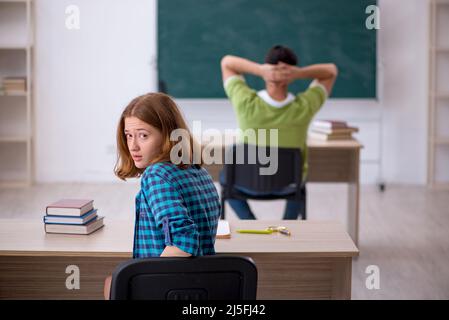Two students sitting in the class Stock Photo
