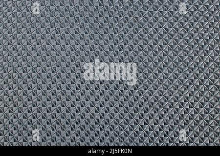 Close up of gray synthetic textured fabric with a rhombus pattern used to make blinds. Template design or polyester material abstract background Stock Photo