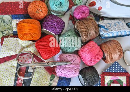 Composition with tailor's threads isolated on artisan mat Stock Photo