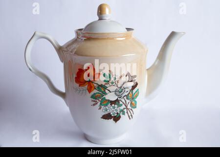 a vintage porcelain teapot teapot isolated on white background Stock Photo