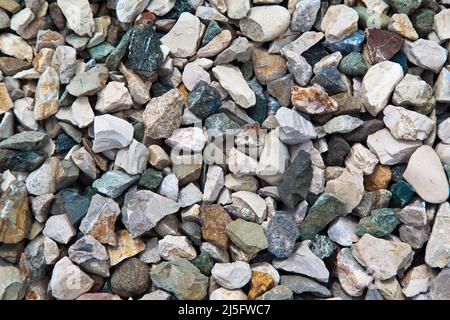 Colored pebbles texture background, decorative small stones texture wallpaper Stock Photo