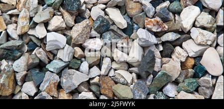 Colored pebbles texture background, decorative small stones texture wallpaper Stock Photo