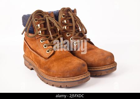 Hiking shoes and a white background, Sturdy hiking boots, strong hiking boots Stock Photo