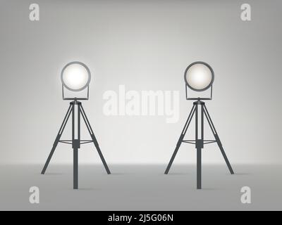 Theater, cinema, studio beaming spotlights on a tripod realistic vector illustration. Turned on and off cine lighting units, lightning equipment for p Stock Vector