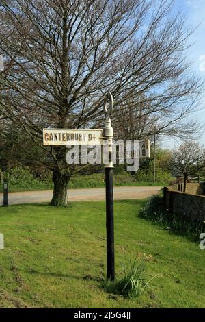 Old signpost pointing towards Canterbury, Wye, Ashford, Stowting, Folkestone and Hythe at Elmsted on the Kent Downs above Ashford, Kent, England, Unit Stock Photo